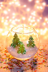 miniature with three paper pinetrees in the aquarium.