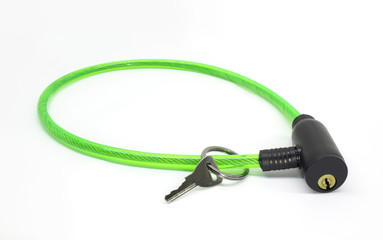 Fototapeta premium Green bike cable lock with key isolated on white background