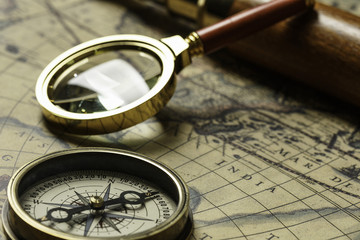 Fototapeta na wymiar Retro compass with old map and spyglass