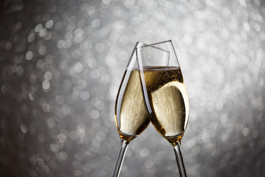 Festive photo of two wine glasses with sparkling champagne