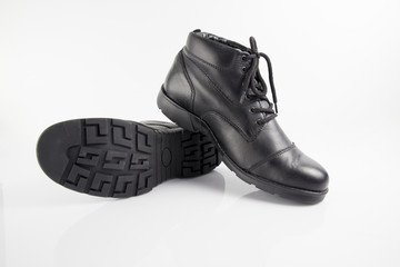 Male black leather boot on white background, isolated product, footwear.