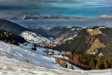 Romanian winter landscape in Carphatians Mountain.The rural winter landscape in the Bran area, Moeciu, Romania