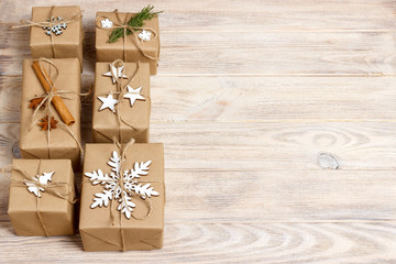 Christmas presents with hand made decorations. Place for text. decorations for wrapped in craft paper gifts