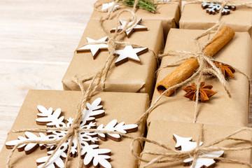 Christmas presents with hand made decorations. Place for text. decorations for wrapped in craft paper gifts