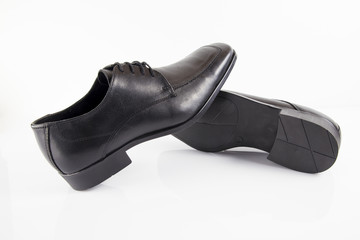 Male black leather shoe on white background, isolated product, footwear.