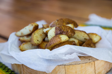 baked potatoes with spices on parchment