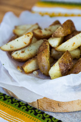 baked potatoes with spices on parchment