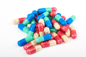 Medicine Pills. Tablets. Capsule.Pharmaceutical medicament, Close-up of pile of blue,white,yellow and green tablets - capsule. Pills and tablets on white background,Assorted pharmaceutical medicine