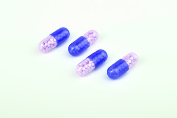 Medicine Pills. Tablets. Capsule.Pharmaceutical medicament, Close-up of pile of blue,white,yellow and green tablets - capsule. Pills and tablets on white background,Assorted pharmaceutical medicine