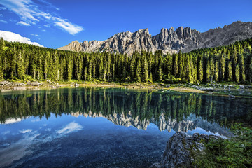 Karersee (Lago di Carezza), is a lake in the Dolomites in South Tyrol, Italy.In the background the mountain range of the Latemar group, Dolomites