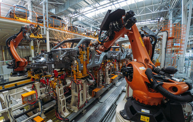 Automobile plant, welding process, modern production of cars, robot equipment, automated production...