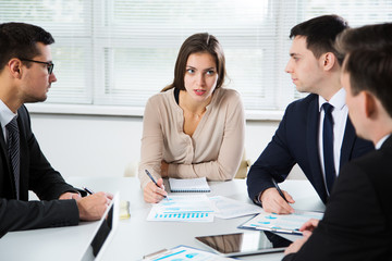 Businesspeople discuss a new project