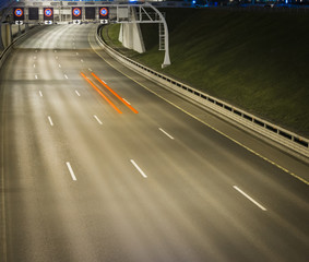 Speed Traffic at Night Time - light trails on motorway highway at night, long exposure abstract urban background