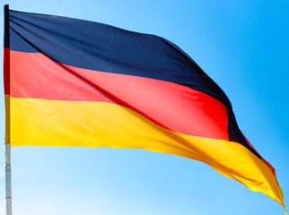 Flag of Germany against the blue sky