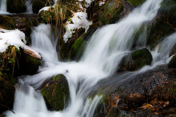 Obraz premium Small brook rushing down through the boulders in the Austrian Alps (long exposure)