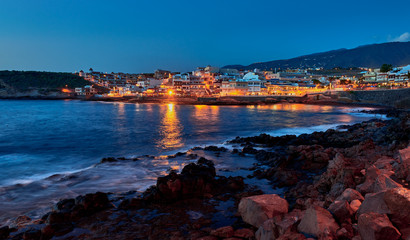 Fototapeta premium Panoramic view of La Caleta de Adeje village in the night time , Tenerife,Canary Islands,Spain.