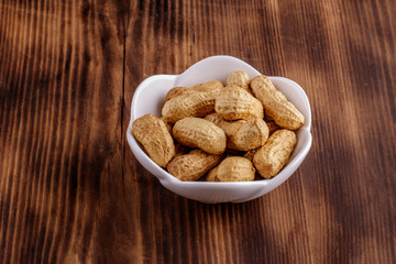 Peanuts on a wooden background