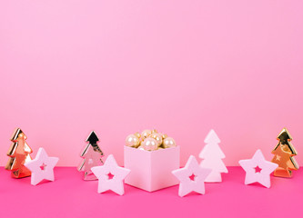 Christmas tree balls on a pink background