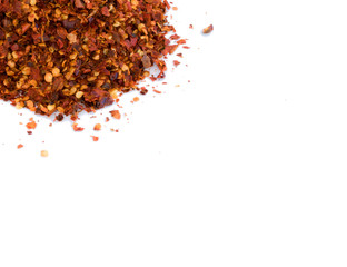 Dried red chili pepper crushes isolated on white background