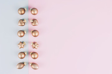 Christmas tree balls on a gray and pink background.
