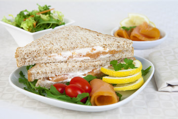 Fototapeta na wymiar Sandwich with Smoked Salmon served on a white dish like an apetizer