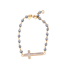 Gold Bracelet with a cross isolated