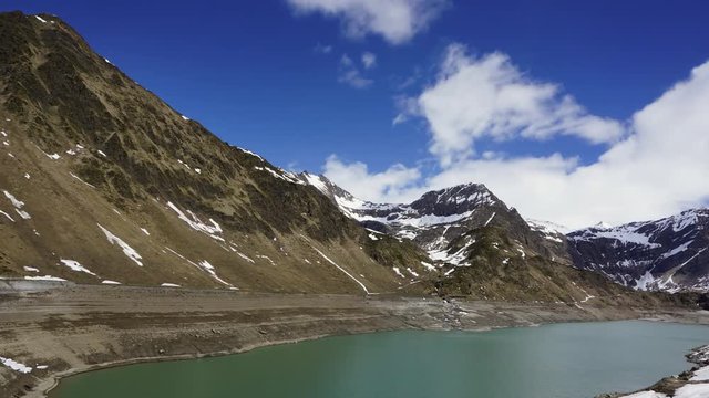 Mountain snow landscape with Lago di Ritom lake in Switzerland, timelapse 4k

