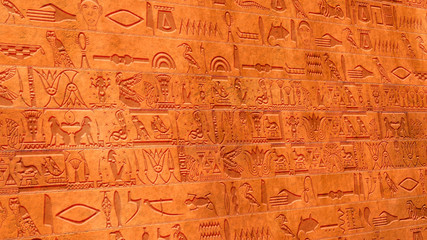 Fototapeta na wymiar Vertical Egyptian Hieroglyphs Ancient Stone Wall
