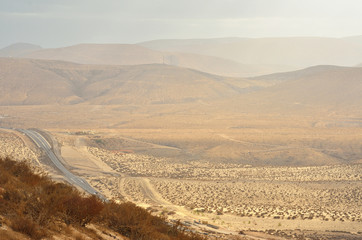 road and clouds near the mountains