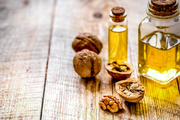cosmetic and therapeutic walnut oil on wooden background