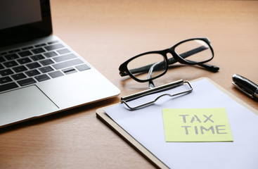 Yellow Paper Note With Words Tax Time