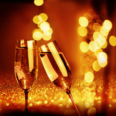 Golden glowing bokeh background with champagne