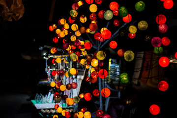 Colored Christmas garland lights on black background. Merry Christmas and Happy New Year