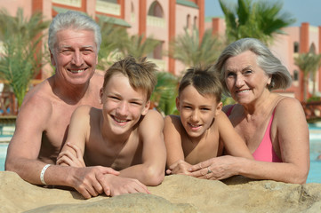Fototapeta na wymiar Happy Elderly couple with grandsons