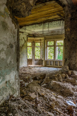 Fototapeta na wymiar Interior of an abandoned mansion