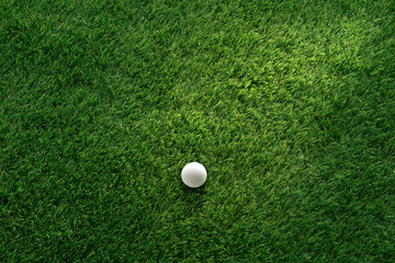 Golf ball on green grass in golf course