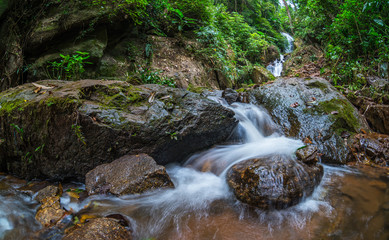 Deep forest waterfall at Doi Hua Mae Kham Waterfall in Chiang Rai, Thailand.