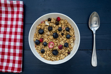 Breakfast cereal bowl with spoon on table