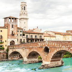 Obraz premium VERONA, ITALY - June 25, 2017: Verona. Bridge Ponte Pietra in Verona on Adige river.