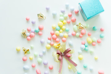Top view blue gift box with ribbon and Colorful balls on white background.