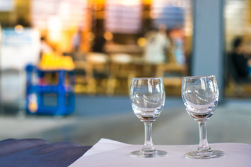 Notepad with wine glass on blurry background. using wallpaper or background for education, business photo. Take note of the product for book with paper and concept or copy space.
