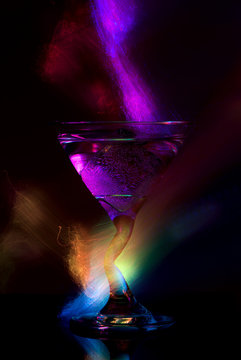 colorful cocktail in glass in neon light