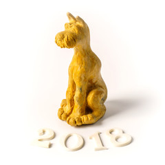 Plasticine figure dog. Dog in Chinese New Year festive setting in white background. 2018 is year of the dog in Chinese lunar zodiac calendar. New Year on the Eastern calendar - Year of the Dog.