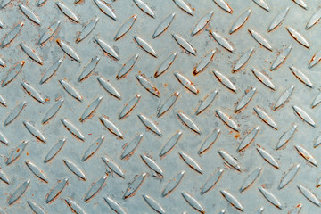 Close-up of metal plate with diamond shapes texture