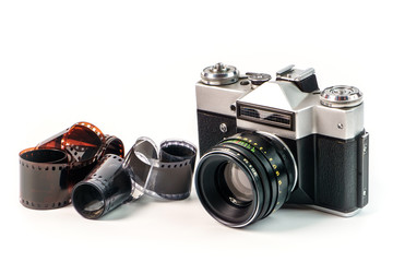 Retro film photo camera isolated on white background. Old analog camera and photo film isolated on...
