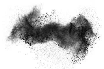 Black powder explosion against white background.The particles of charcoal splatted on white...