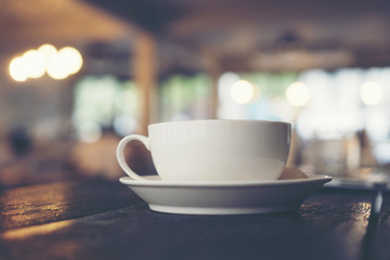coffee cup on the wooden table in cafe