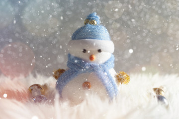 Happy snowman standing in winter christmas snow background. Merry christmas and happy new year greeting card with copy-space. Christmas celebration holiday background.
