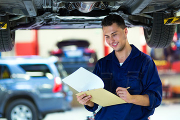 Car mechanic in workshop 