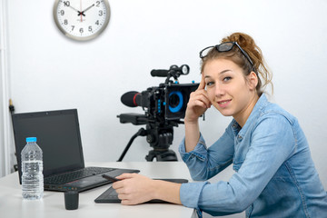 Naklejka premium young woman designer using graphics tablet for video editing